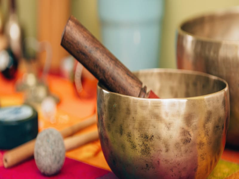 Singing bowl with wooden striker.